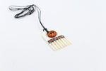 Bone Comb and Koru Pendant with Staining