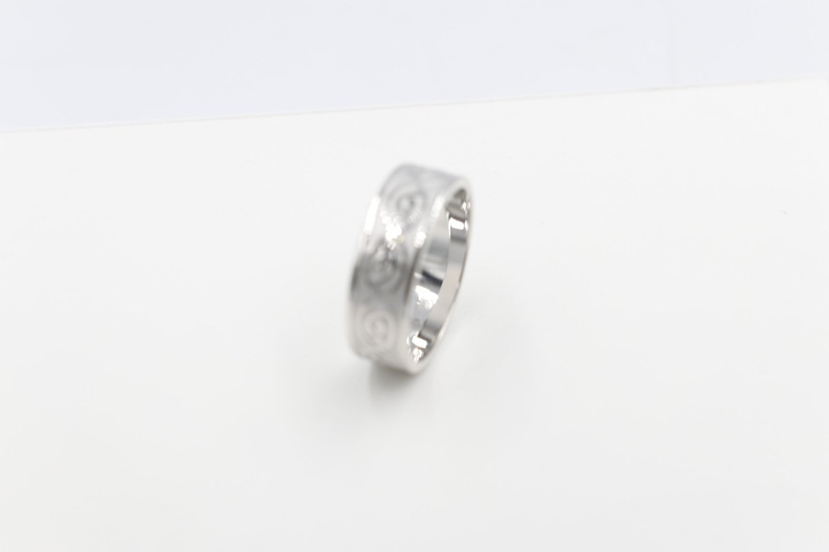Stg Silver Band with Maori design 7mm FR5250S