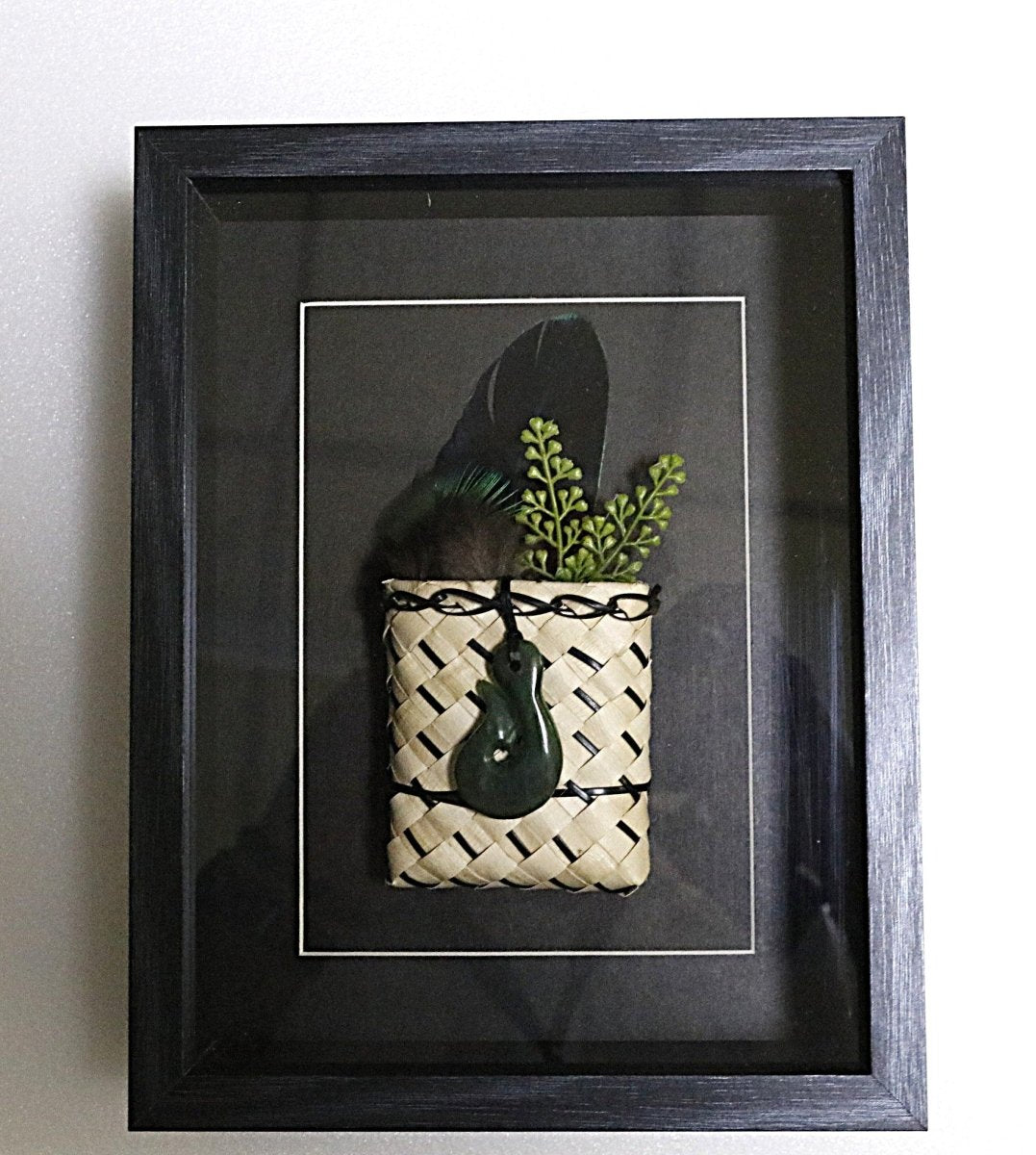 Framed New Zealand Greenstone Fish Hook with Feathers & Kete