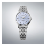 Silver Seiko watch with a light blue face on a gray background