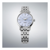 Silver Seiko watch with a light blue face on a gray background