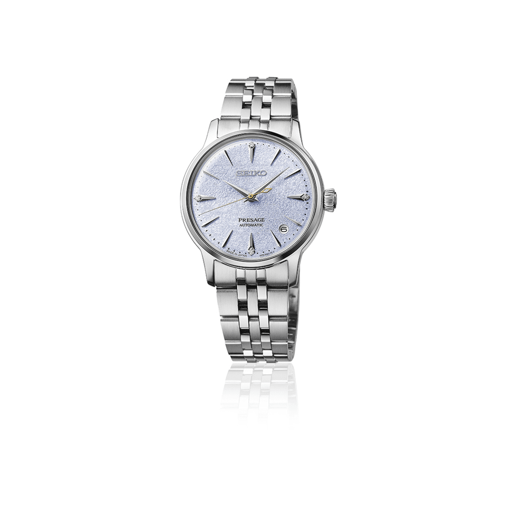 Silver Seiko watch with a white face on a white background