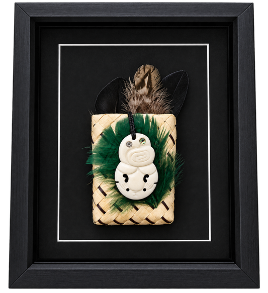 Framed New Zealand Bone Hei Tiki with Feathers & Kete