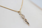 10K Gold Diamond Infinity Pendent 0.10ct