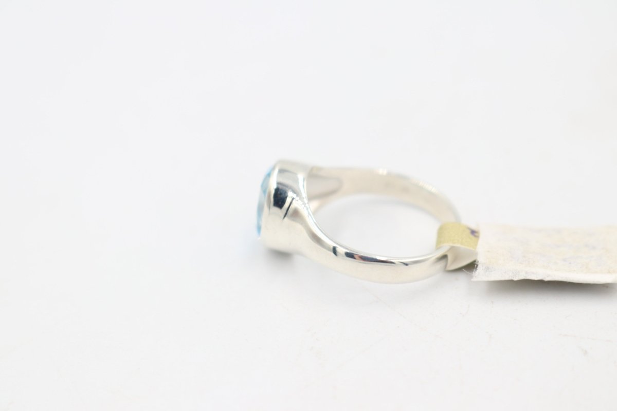 Stg Silver Blue Topaz Ring with Dolphin Etching