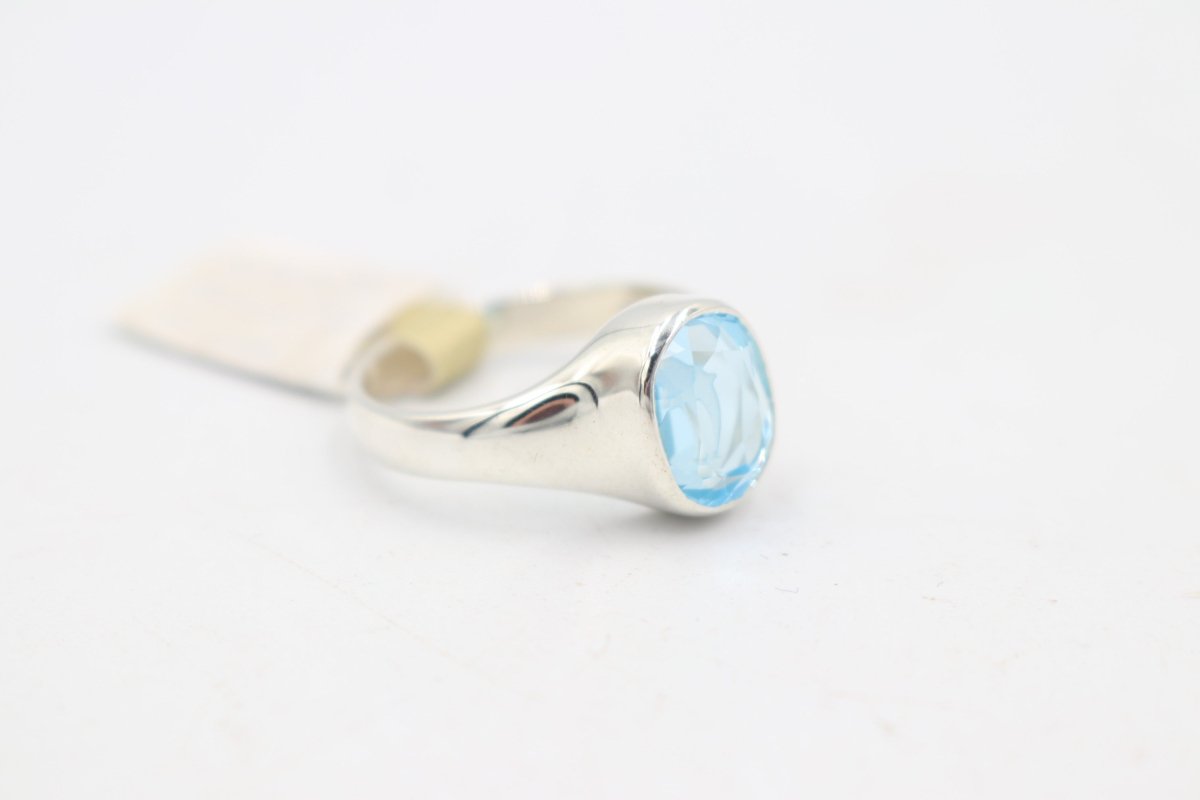 Stg Silver Blue Topaz Ring with Dolphin Etching
