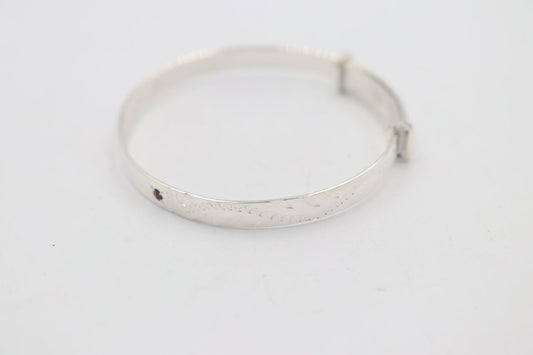 Sterling Silver Childs Patterned Expander with garnet