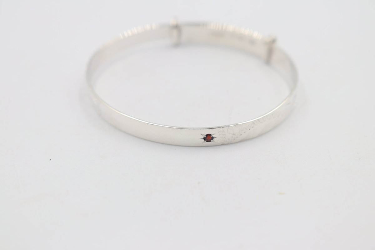 Sterling Silver Childs Patterned Expander with garnet