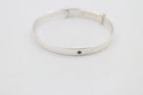 Sterling Silver Childs Patterned Expander with garnet