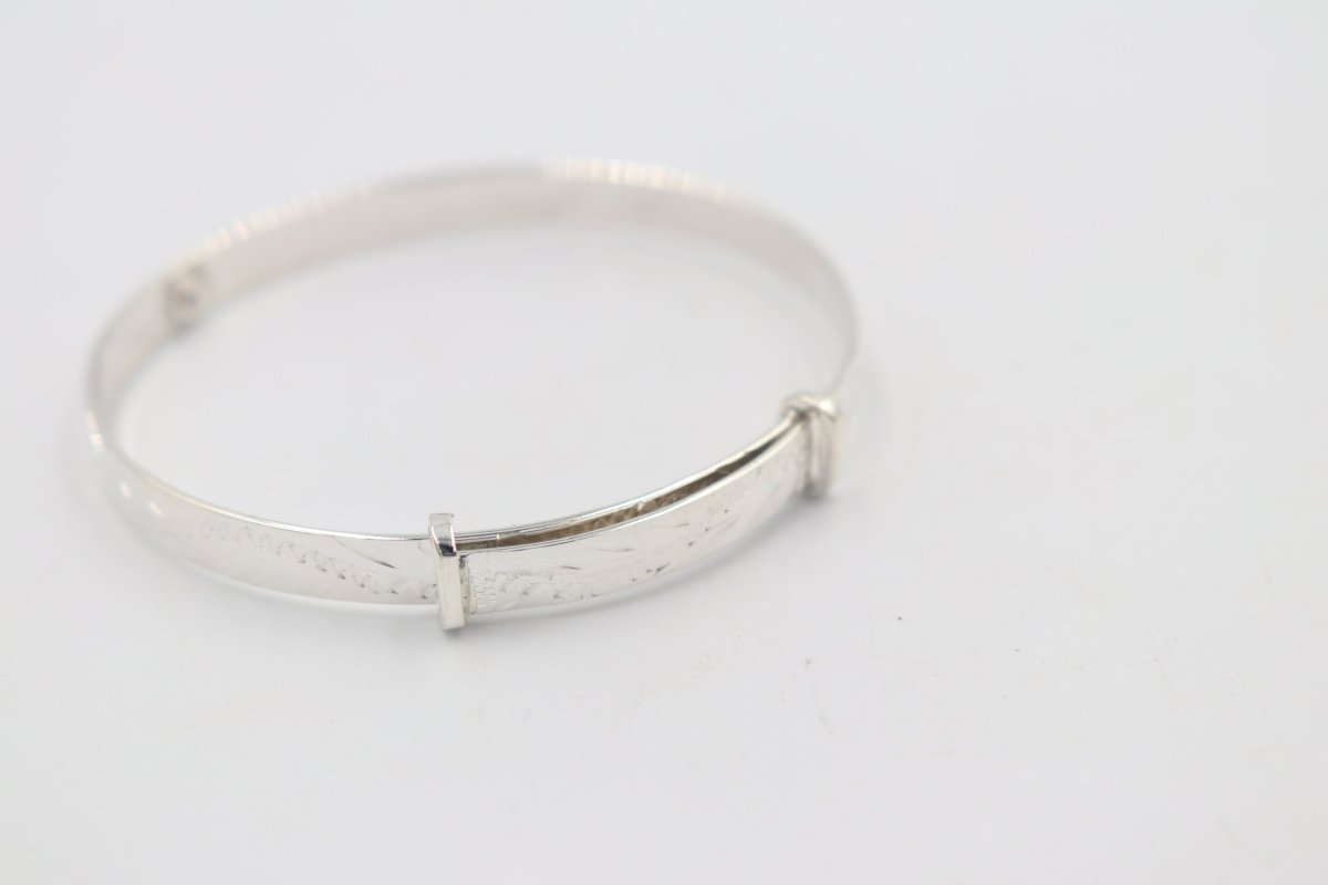 Sterling Silver Childs Patterned Expander with garnet