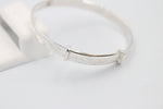 Sterling Silver Childs Patterned Expander with garnet